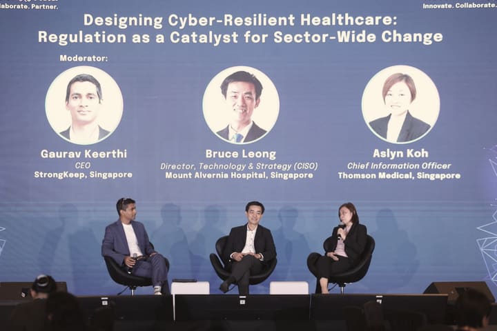 Gaurav moderating a panel of two hospital technology leaders.